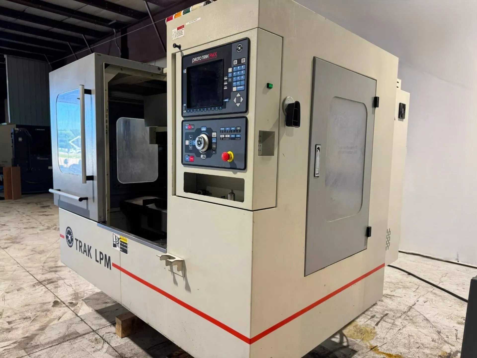 2011 SOUTHWESTERN INDUSTRIES TRAK LPM VMC, PROTOTRAK PMX, 8K RPM, 16 ATC, 35.4X19.6 TABLE - VERTICAL MACHINING CENTERS