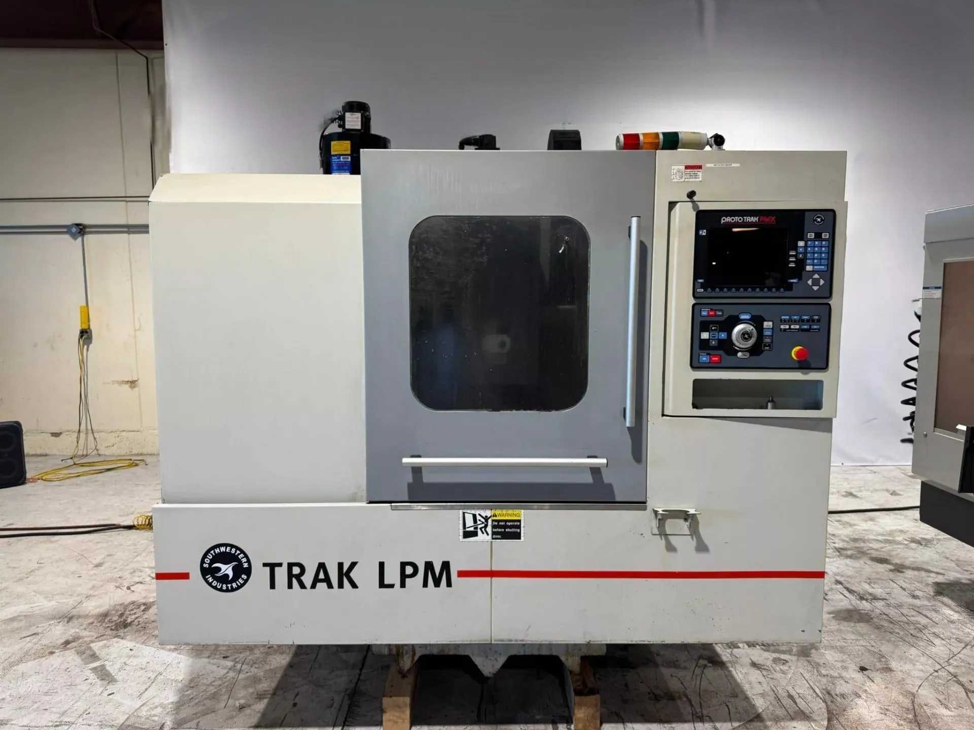 2011 SOUTHWESTERN INDUSTRIES TRAK LPM VMC, PROTOTRAK PMX, 8K RPM, 16 ATC, 35.4X19.6 TABLE - VERTICAL MACHINING CENTERS