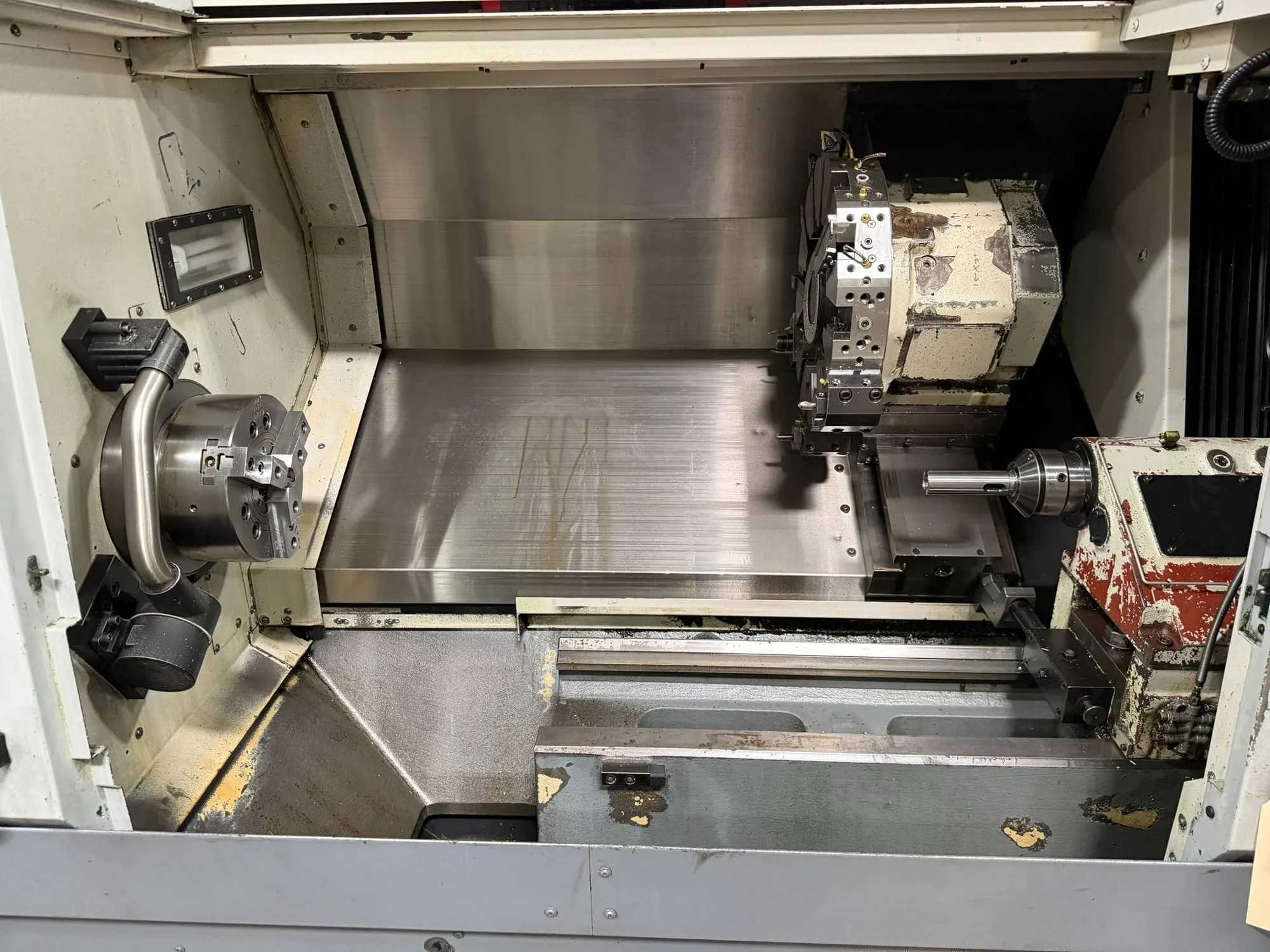 2012 OKUMA GENOS L400E CNC TURNING CENTER, 3000 RPM, 10-INCH CHUCK, 12-POS TURRET, OSP-P200L-R - CNC LATHES